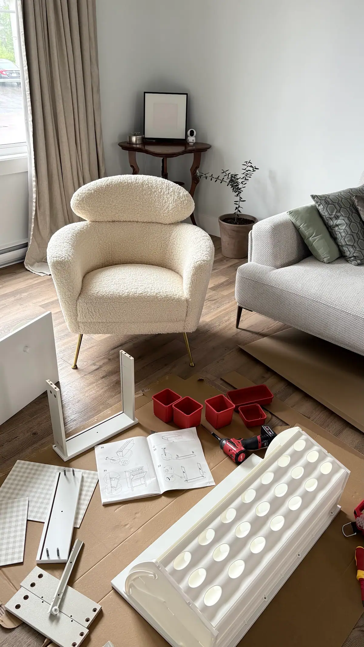 Furniture and organized parts ready for professional assembly in a living room